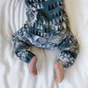 close up photo of the fabric in the Lottie & Lysh Artic owls long leg popper romper for babies and children