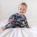 sweet baby wearing a lottie and lysh artic owls popper romper