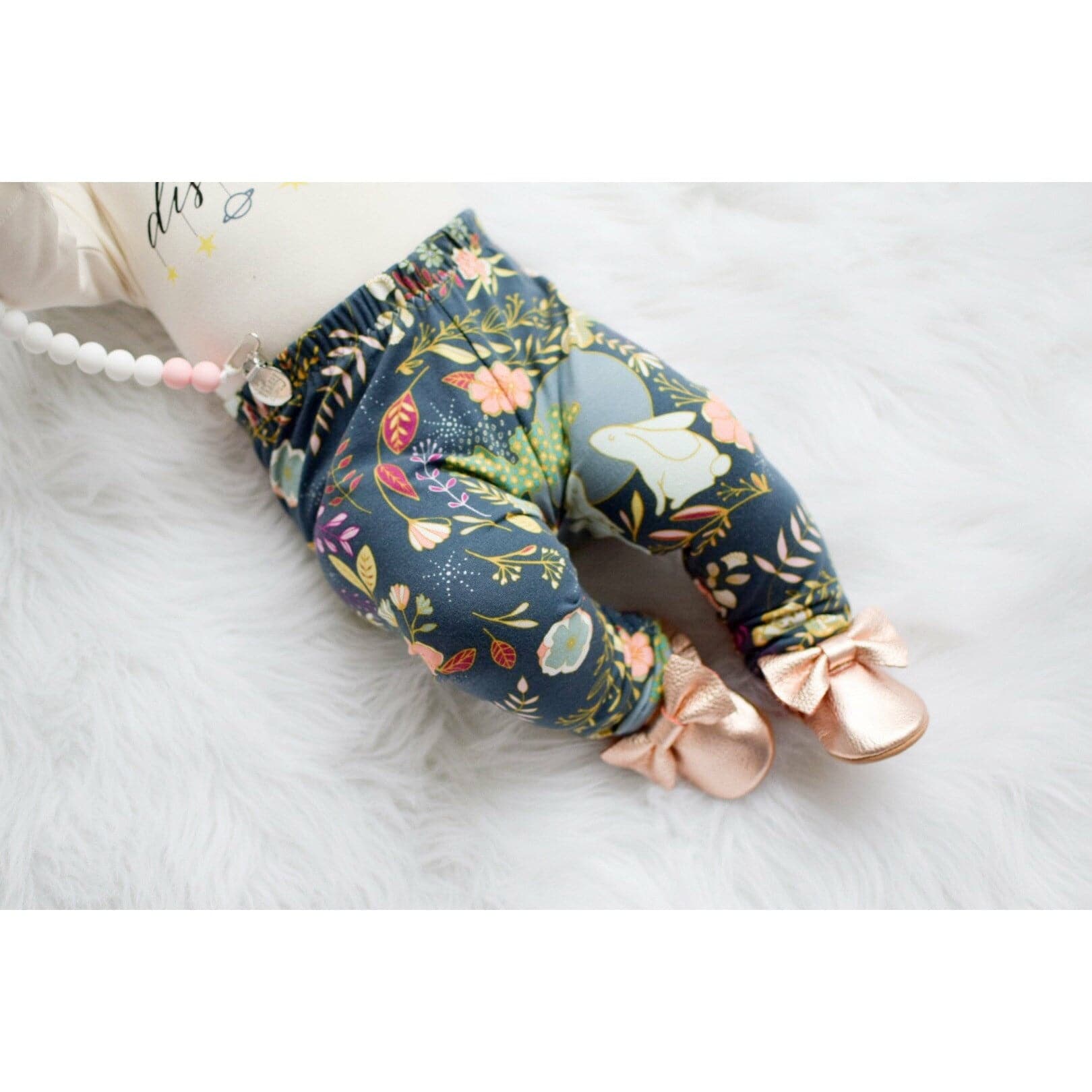 Autumn Glow printed floral baby leggings handmade by lottie & lysh styled with rose gold baby shoes and teether