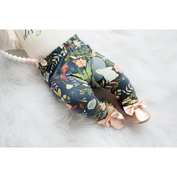 Autumn Glow printed floral baby leggings handmade by lottie & lysh styled with rose gold baby shoes and teether