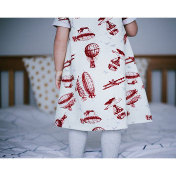 Children's dress featuring vintage modes of air travel