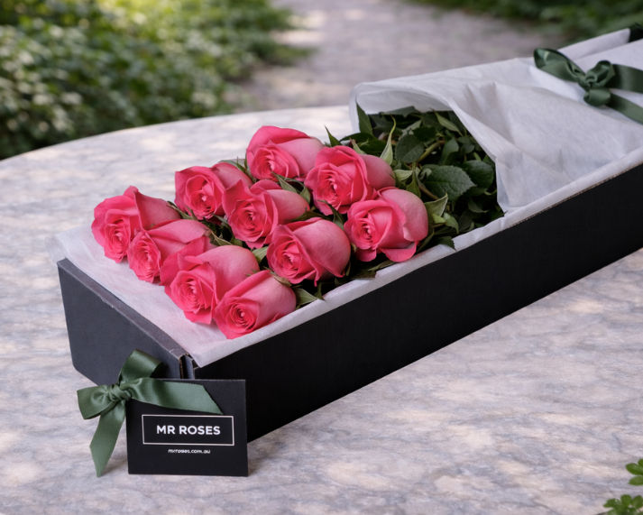 dozen long stemmed pink roses in gift box