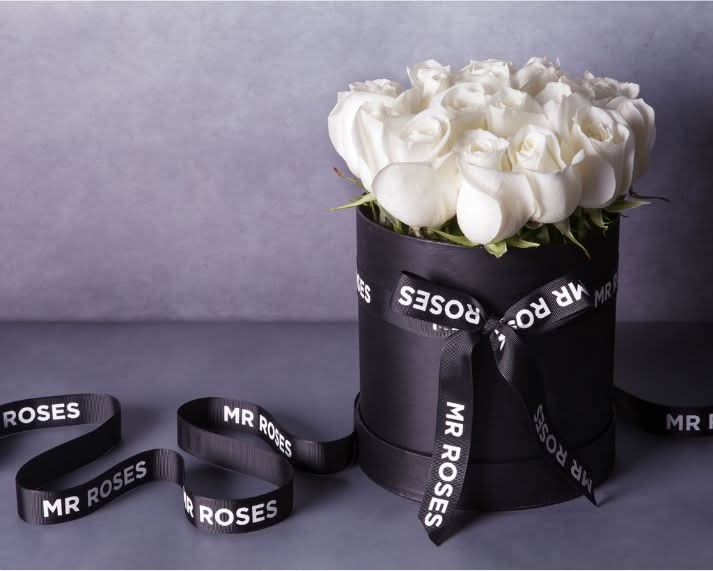 fresh white roses in stylish mr roses hat box