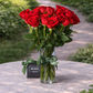 medium stemmed red roses in a vase