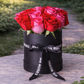 fresh red and pink roses in stylish mr roses hat box