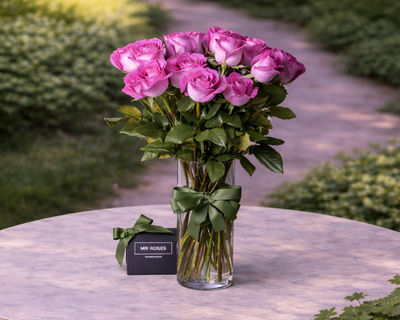 purple roses in a vase