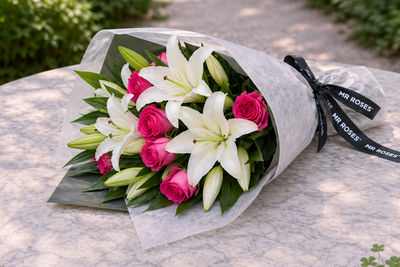 white lilies and pink roses bouquet