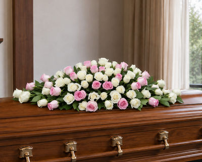 stunning pink and white casket spray by Mr roses