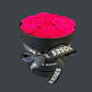 pink preserved roses in hat box
