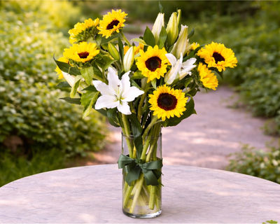 sunflowers and white lilies flower arrangement 