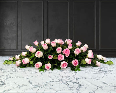 funeral spray of pink roses, funeral flowers and casket flowers in white