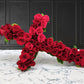 red rose cross wreath for funeral flowers and casket flowers