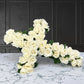 white rose cross wreath. Funeral flowers and casket flowers