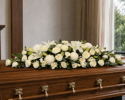 stunning funeral flower casket spray by Mr Roses