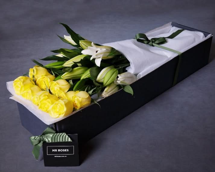 fragrant white lilies and yellow roses arrangement