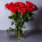 medium stemmed red roses in a vase