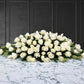 funeral spray of white roses, funeral flowers and casket flowers in white