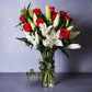 Fragrant white lilies and red roses flower arrangement