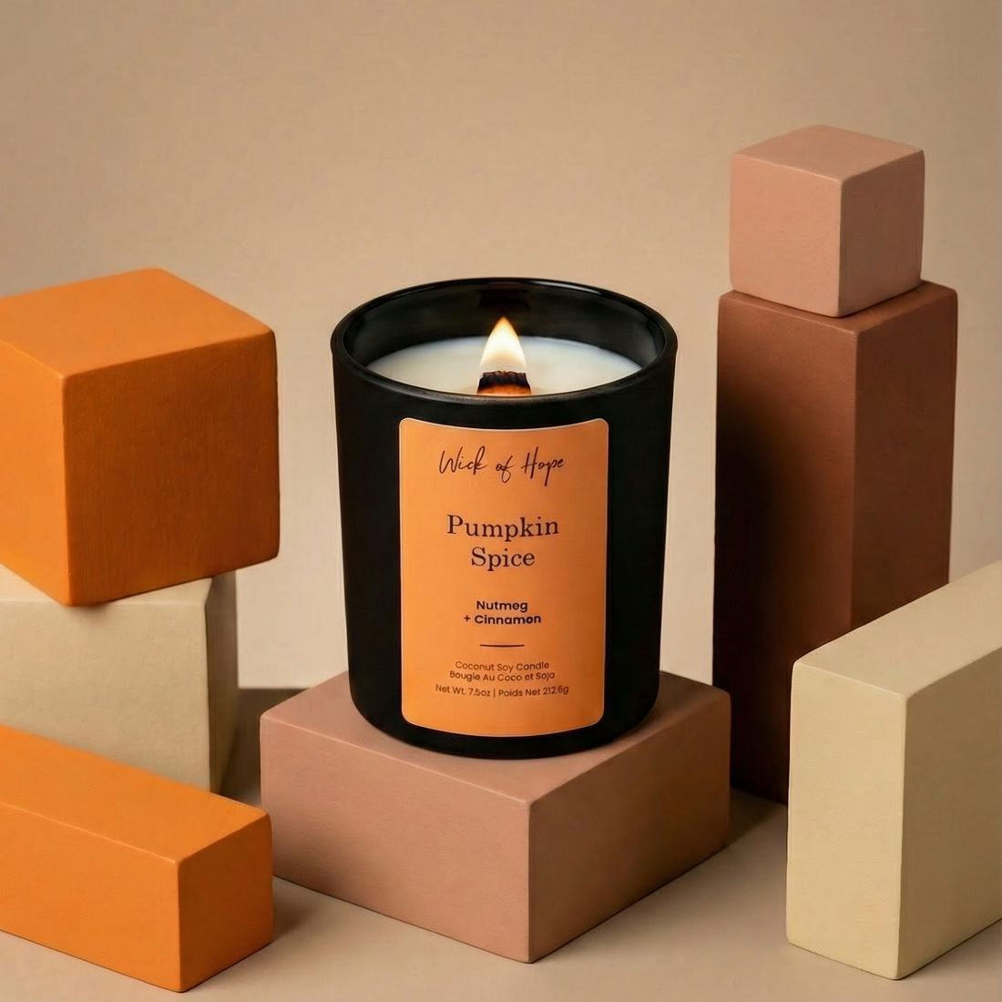 Pumpkin spice candle on a geometric background