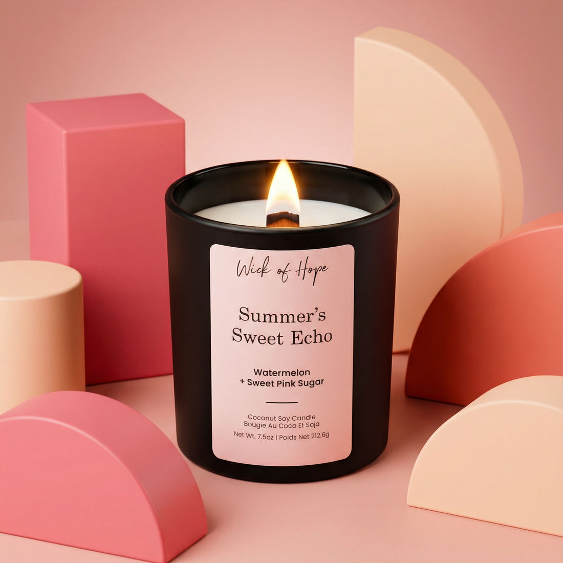 Candle labeled 'Summer's Sweet Echo' by Wick of Hope on a pink background with geometric shapes.