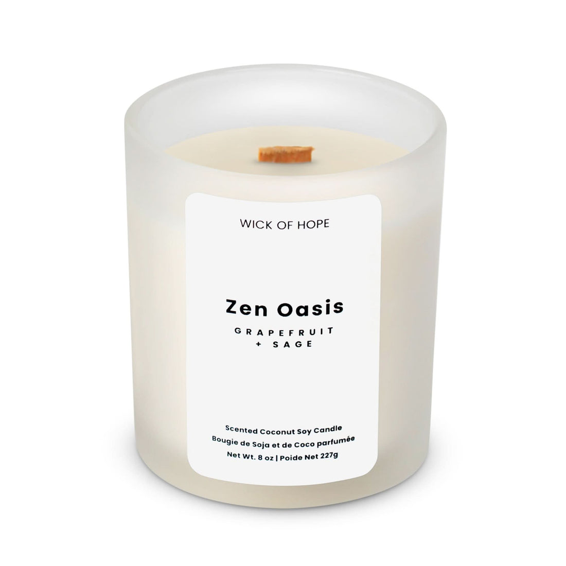 The Wick of Hope Zen Oasis Candle—Grapefruit + Sage—is an 8 oz white frosted glass candle with a wooden wick, crafted with coconut soy wax for a calming, spa-like atmosphere.