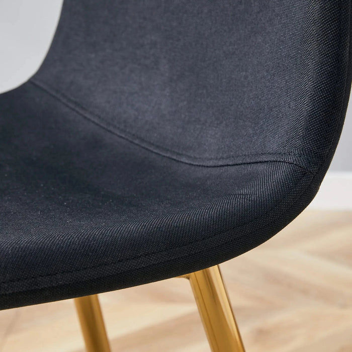 Table and chair set. Modern multifunctional lifting platform, white textured sticker MDF desktop, gold metal legs. Paired with four black dining chairs made of linen fabric. Default -DTYStore