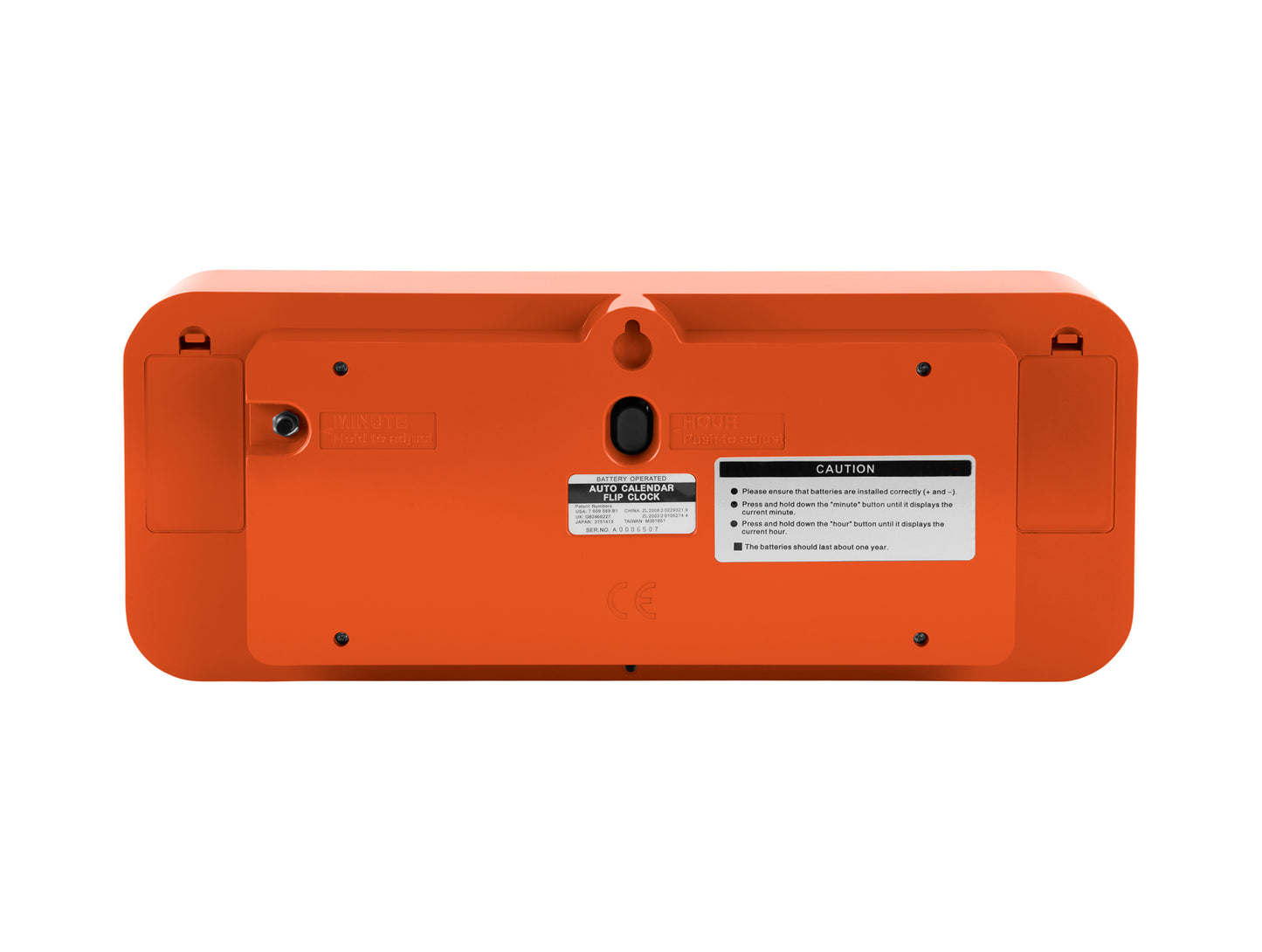 Arrière d'une horloge murale orange avec compartiment à piles et points de fixation