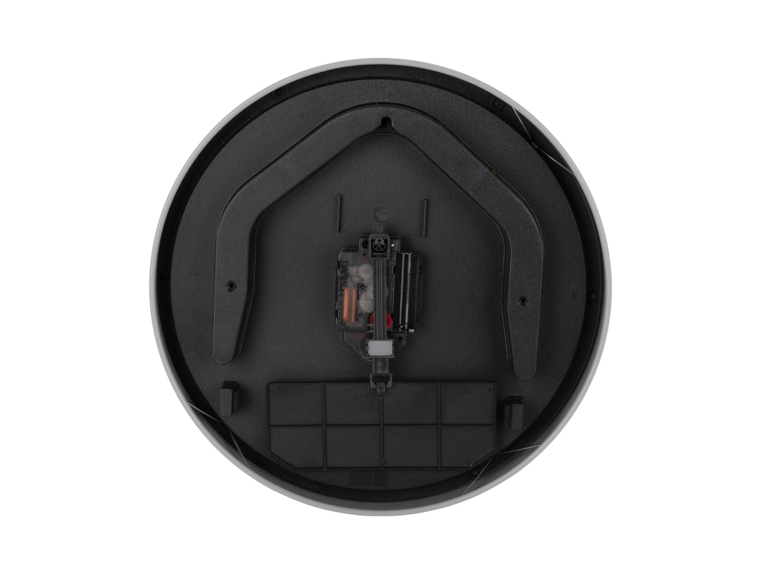 Fond noir d'une horloge murale avec mécanisme et points de fixation dans le boîtier