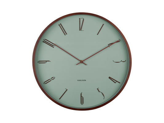 Horloge murale avec cadran couleur menthe, bordure marron et aiguilles rouges