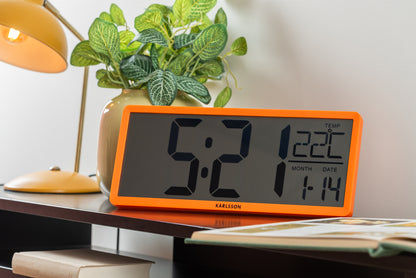 Horloge murale rétro LCD orange néon sur table avec affichage numérique de l'heure et de la date