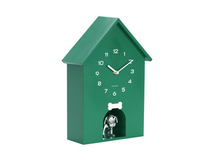 Horloge murale verte en forme de niche avec cadran et figurine de chien