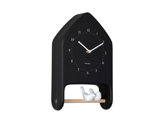 Horloge murale noire en forme d'oiseau avec deux reliefs d'oiseaux blancs en bas