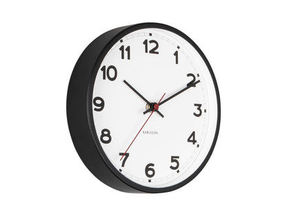 Petite horloge murale avec cadran blanc et bordure noire, aiguilles avec accent rouge