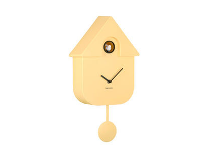 Horloge murale design nichoir, boîtier jaune avec cadre en métal et balancier