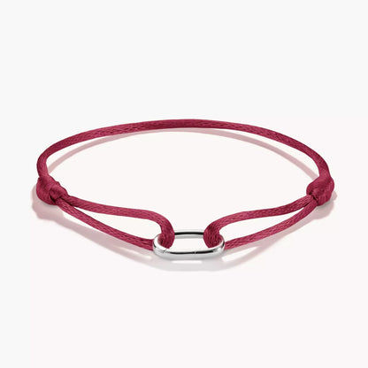 Bracelet textile en ruban rouge avec anneau de connexion argenté et extrémités nouées