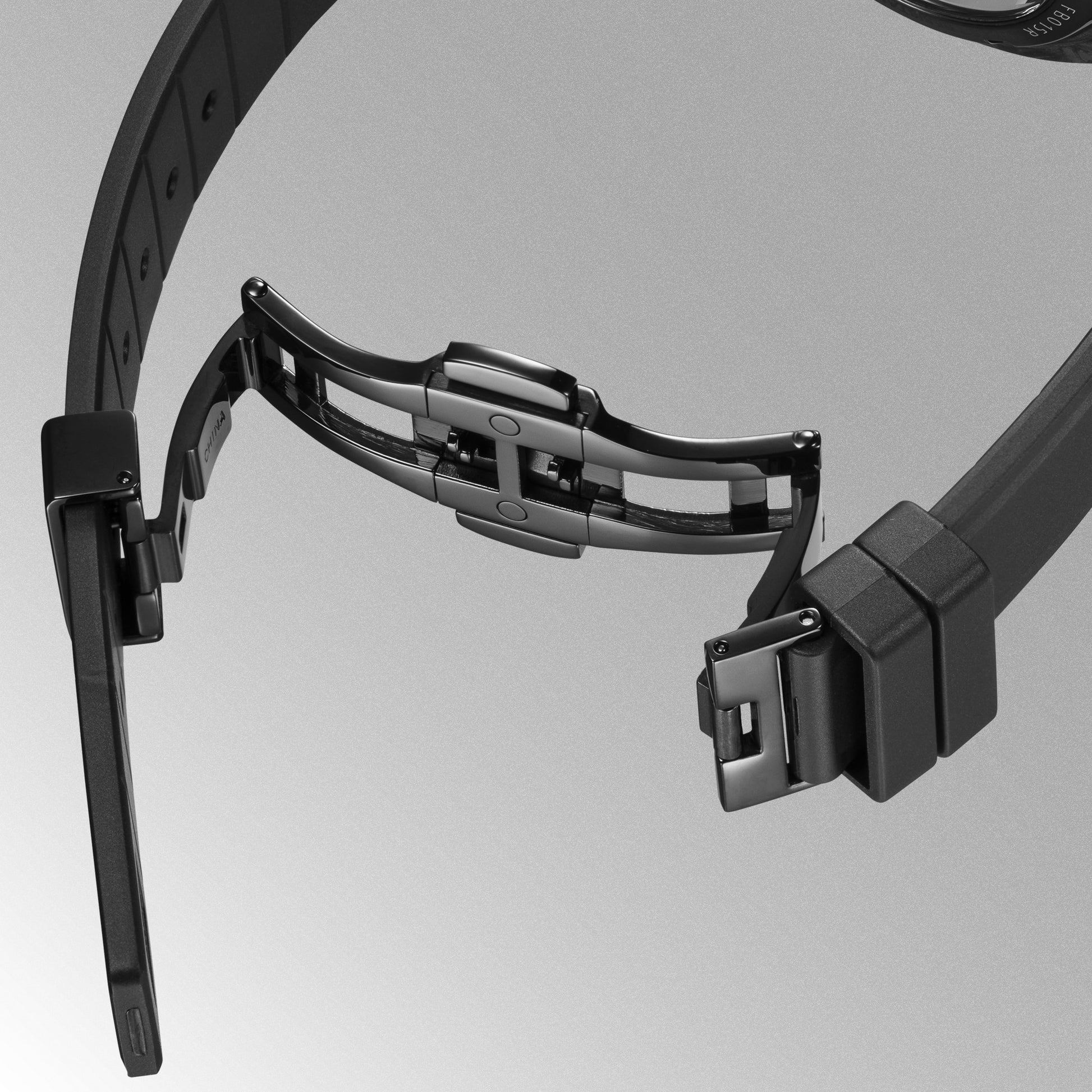 Schwarzes Uhrenarmband mit verstellbarer Schließe und Befestigung am Gehäuse
