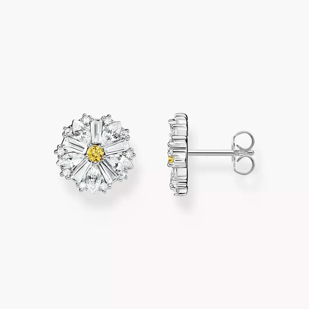 Clous d'oreilles argentés en forme de fleur avec centre jaune et pierres scintillantes