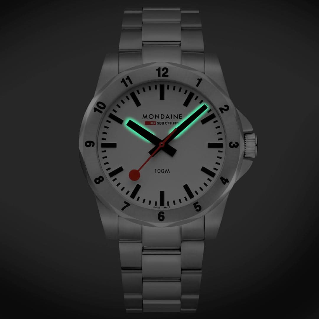Montre analogique pour homme avec cadran blanc et index lumineux verts