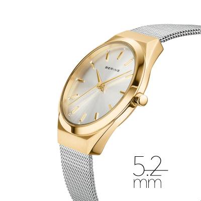 Bering Damenuhr mit schmalem goldfarbenem Gehäuse, silbernem Milanaiseband und Uhrkrone