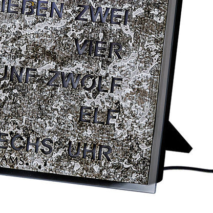 Horloge murale avec affichage LED textuel, cadre noir et support métallique latéral