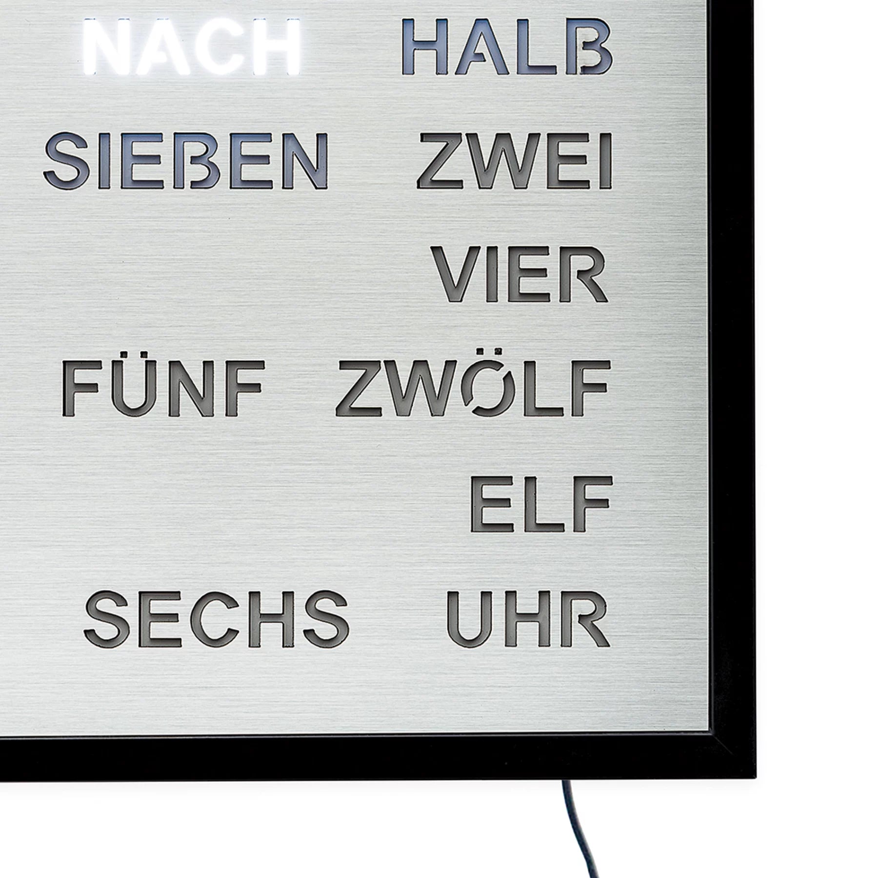 Cadran d'horloge murale LED découpé avec champ de mots argenté et mots lumineux, cadre noir.