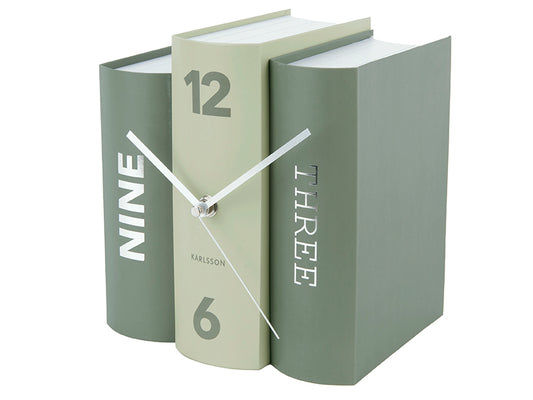 Montre de table verte en forme de livre avec les chiffres 12 et 6 et des aiguilles