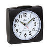 Réveil compact noir avec cadran rond et chiffres arabes