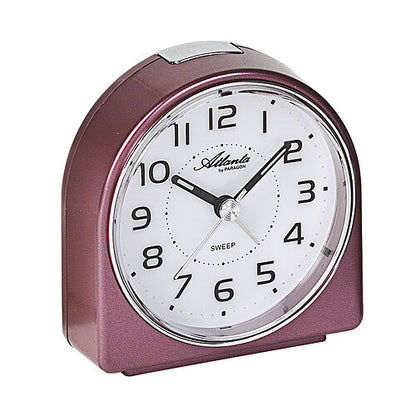 Réveil compact à quartz bordeaux avec cadran analogique et façade incurvée