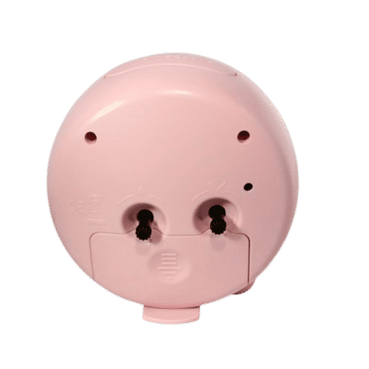 Arrière du réveil enfant, boîtier rose avec deux ouvertures pour vis et ports.