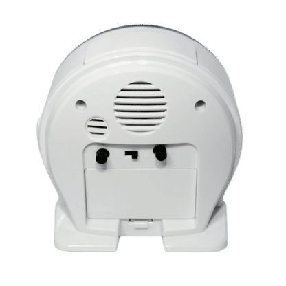 Arrière du réveil avec grille de haut-parleur et ports, boîtier en plastique blanc
