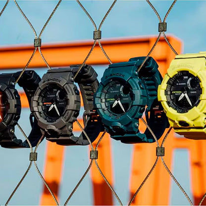 Casio G-Shock Herrenuhr, schwarz-türkis-gelb, runde Digital- und Analoganzeige