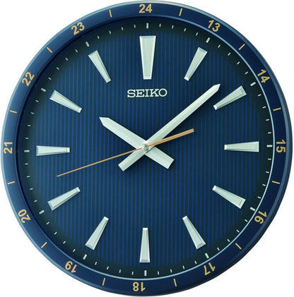 Cadran bleu de l'horloge murale Seiko avec aiguilles blanches, index et inscription SEIKO