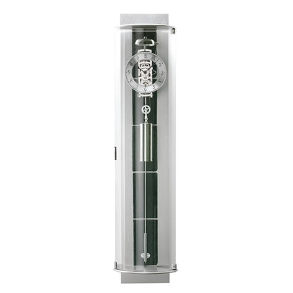 Väggklocka i transparent cylinder med mekaniskt urverk och inslag av grön skiffer