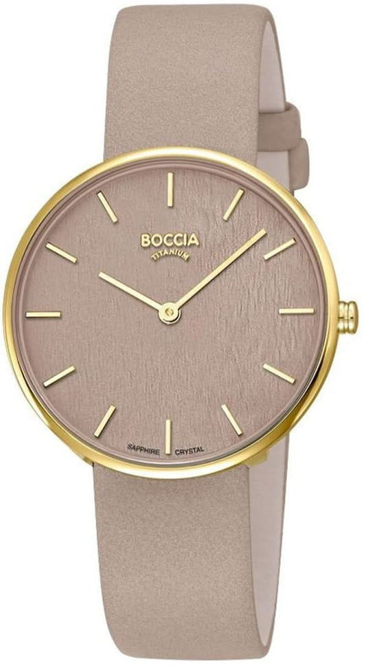 "Damklocka med beige band, runt guldfärgat boett och rosa urtavla"